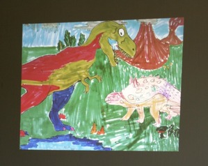 Les dinosaures à la bibliothèque avec le raconte-tapis et le dessin animé.